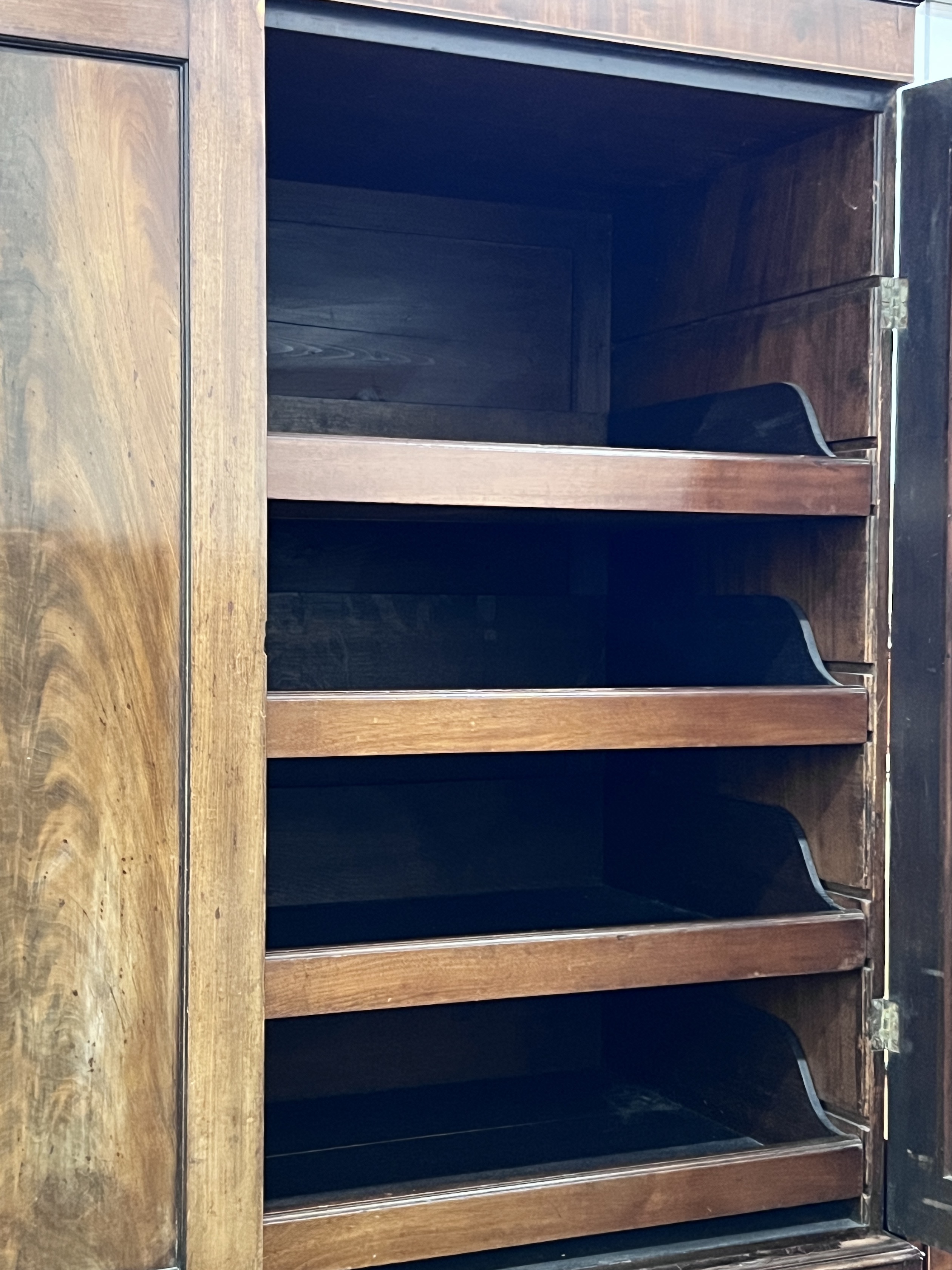 A George III mahogany linen press, width 124cm, depth 57cm, height 215cm